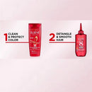 L'Oreal Elvive hair care products on a light pink background