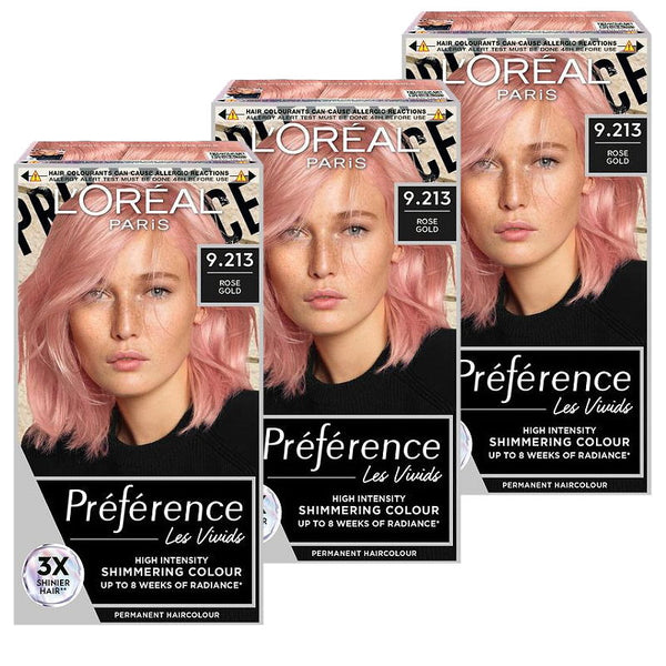 L'Oreal hair color boxes with pink hair samples on a white background