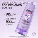 L'Oreal Elvive conditioner bottle with eco-friendly packaging details on a light purple background