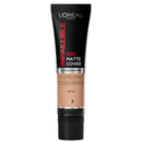 L'Oréal Paris L'Inférible Matte Cover foundation in a black squeeze tube with a beige foundation color visible through the center, on a white background.