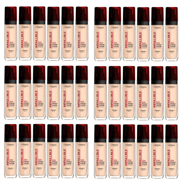 Multiple bottles of L'Oreal Infallible foundation with red caps on a white background