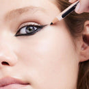 Discover premium cosmetics from trusted brands at Makeup Warehouse. Shop our extensive range of makeup and beauty products with free shipping on orders across Australia. Backed by thousands of 5-star customer reviews, we're your go-to destination for quality beauty essentials. Why settle for less when you can get the best? - Close-up of a model's eye as an applicator applies black eyeliner pencil to the upper lash line. 