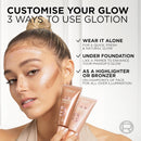 Advertisement for L'Oreal Glotion with a woman applying it to her face and text on how to use it.