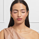 L'Oreal Paris Paradise Le Shadow Stick 245 Alluring Rose Woman wearing gold earrings with a neutral background