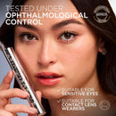Woman holding a makeup product with text about ophthalmological control and suitability for sensitive eyes.