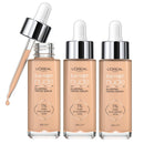 Four bottles of L'Oreal Paris True Match Nude Plumping Tinted Serum with applicators, showcasing the serum in a neutral shade.