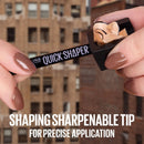 Quick Shaper pen being held with a blurred building background - Maybelline Brow Shaper Eyebrow Pencil Deep Brown